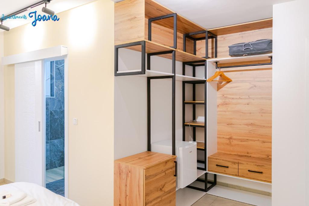 Modern studio apartment with wooden feature wall